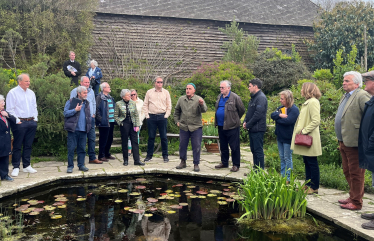 Huw and parish councillors at sunken garden in Great Dixter talking to Head Gardener, Fergus Garrett